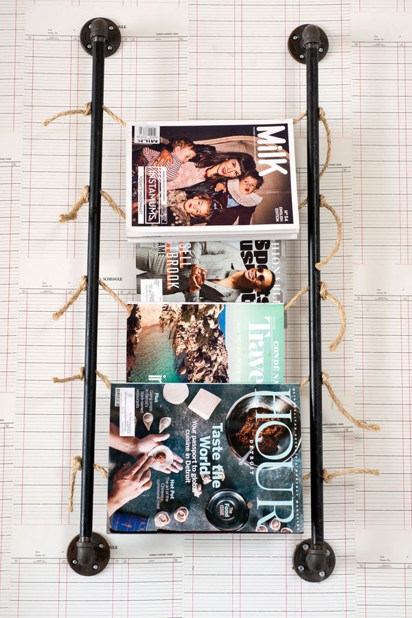 A pipe-and-rope magazine rack